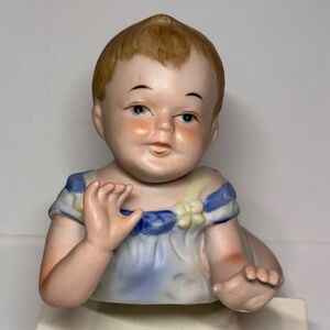 Vintage porcelain bisque hand painted piano baby